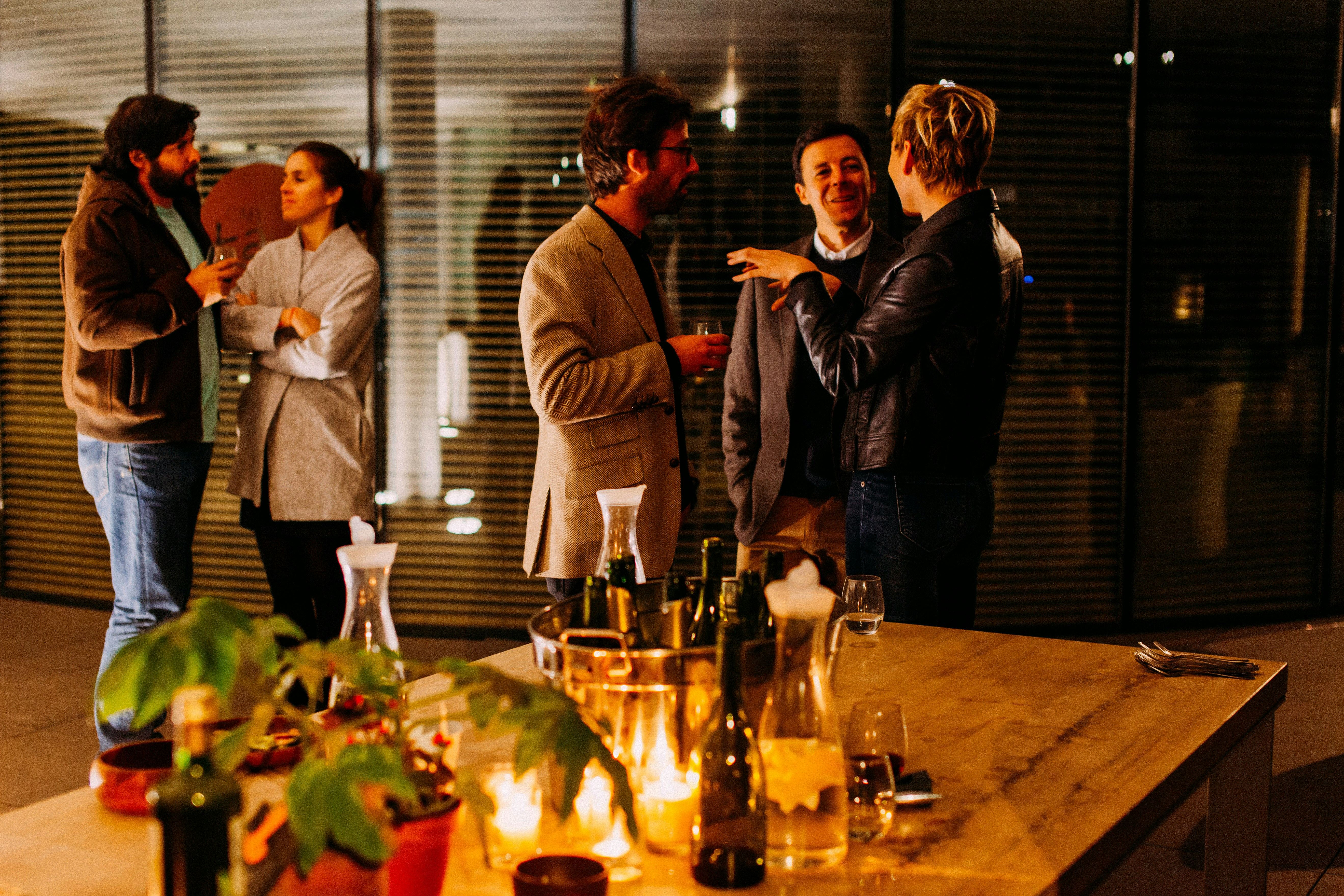 Business professionals networking at an event, exchanging contact information using Mia PRM